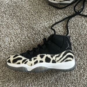 Brand new Women’s Air Jordan 11s. Black and white cheetah print.